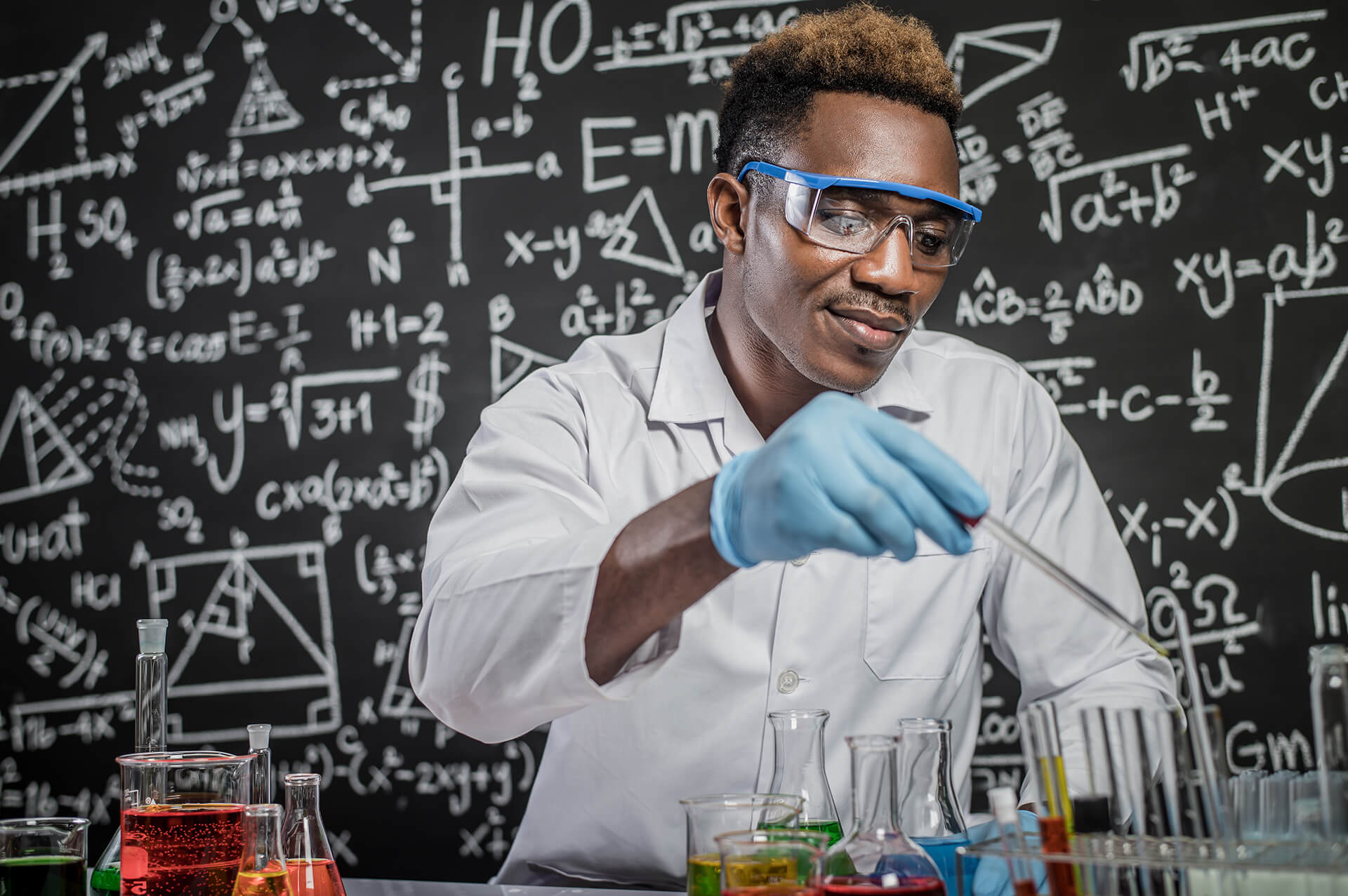 Scientists Drop Chemicals into the Glass at the Laboratory (1)
